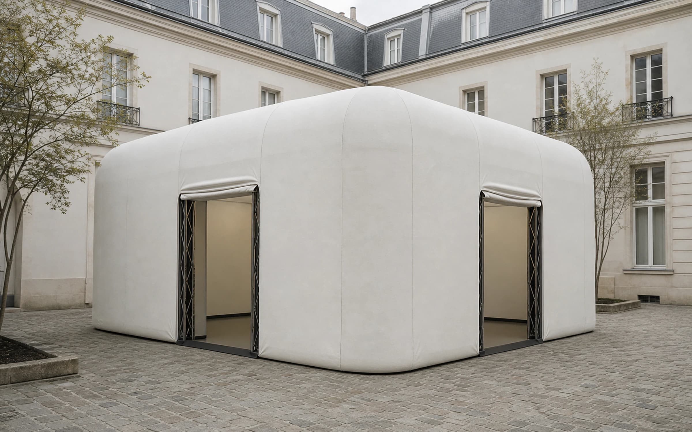 The compact travelling volume of Drift Gallery installed in a courtyard
